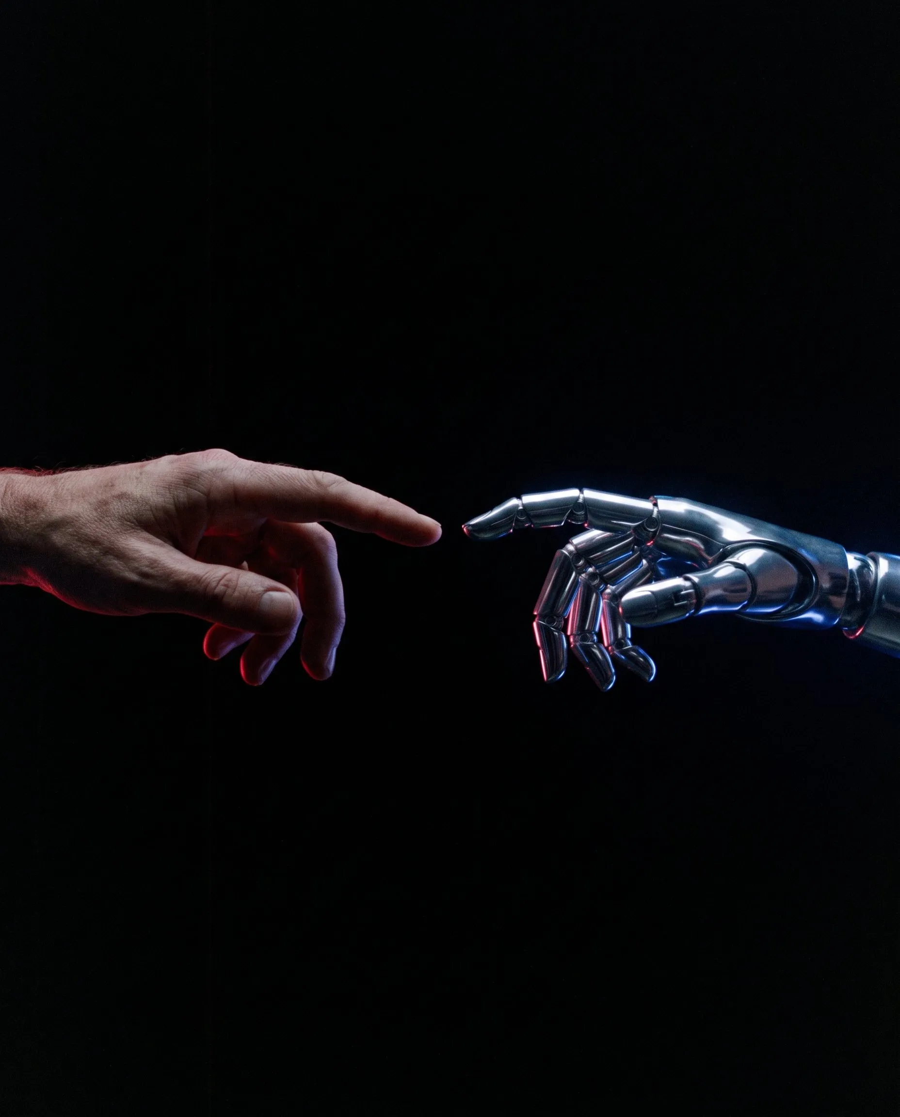 A human hand and a robotic hand reaching for each other